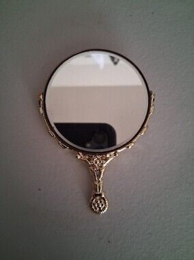 Vintage Gold-tone  Handheld Mirror With Cerub On Back.  Mirror Moves